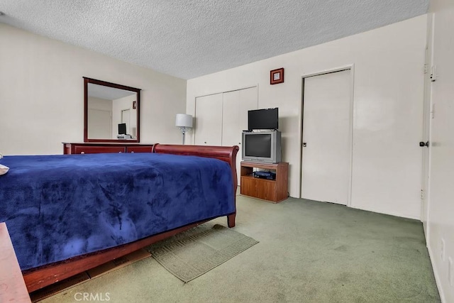 5348 Fairview Blvd Unit 3, Ladera Heights, CA 90056 - bedroom featuring two closets, carpet flooring, and a textured ceiling