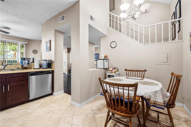 1441 Brett Pl Unit 136, San Pedro, CA 90732 - dining room with a chandelier, baseboards, ceiling fan, light tile patterned floors, and a high ceiling