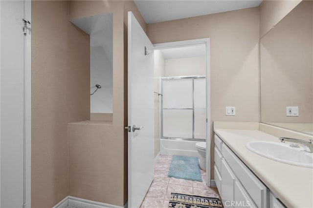 1441 Brett Pl Unit 136, San Pedro, CA 90732 - bathroom featuring toilet, vanity, combined bath / shower with glass door, and tile patterned flooring