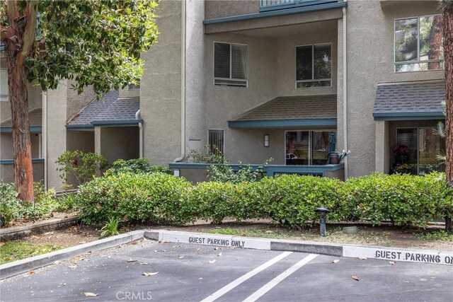 1441 Brett Pl Unit 136, San Pedro, CA 90732 - view of property featuring uncovered parking
