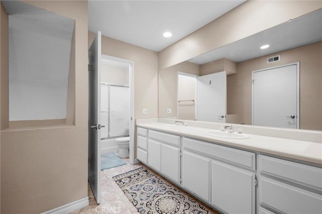 1441 Brett Pl Unit 136, San Pedro, CA 90732 - bathroom featuring double vanity, toilet, tub / shower combination, tile patterned flooring, and recessed lighting