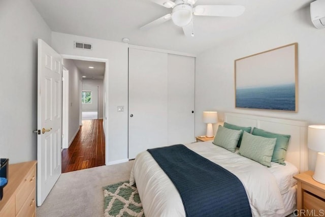 14040 Old Station Rd, San Diego, CA 92064 - bedroom with a closet, a wall mounted air conditioner, a ceiling fan, and carpet floors