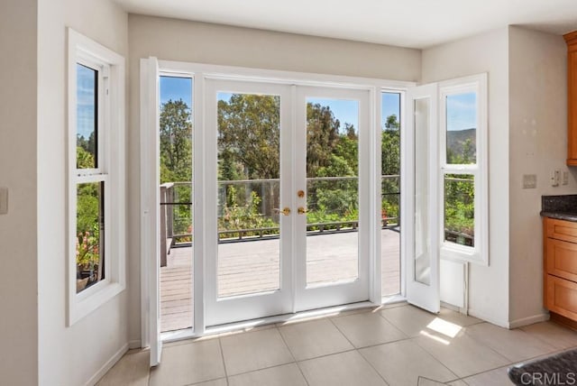 14040 Old Station Rd, San Diego, CA 92064 - doorway to outside featuring light tile patterned floors, baseboards, and french doors