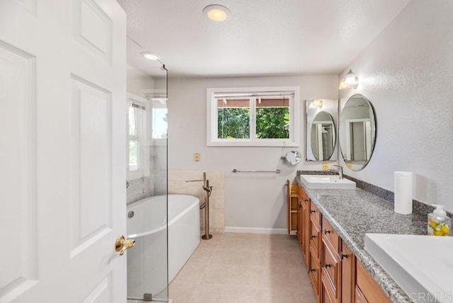 14040 Old Station Rd, San Diego, CA 92064 - full bath with a freestanding tub, double vanity, baseboards, and tile patterned floors