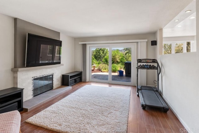 14040 Old Station Rd, San Diego, CA 92064 - workout area with a fireplace, wood finished floors, recessed lighting, and baseboards