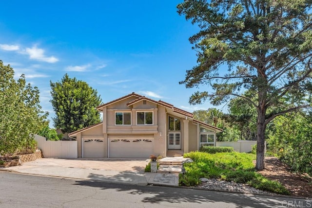 14040 Old Station Rd, San Diego, CA 92064 - view of front facade featuring concrete driveway, an attached garage, and stucco siding