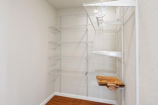 14040 Old Station Rd, San Diego, CA 92064 - walk in closet featuring wood finished floors