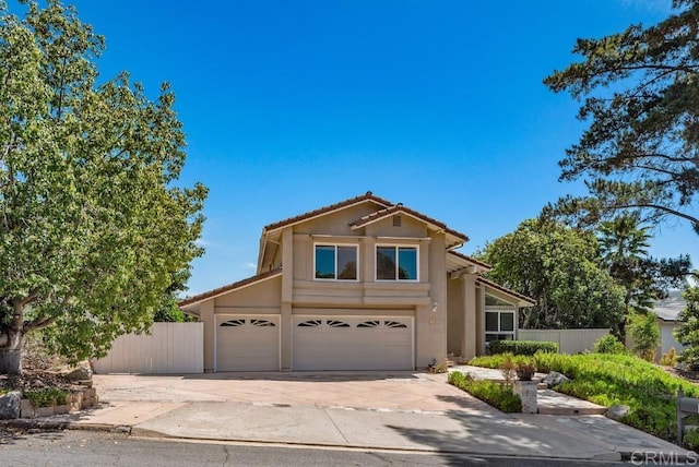 14040 Old Station Rd, San Diego, CA 92064 - traditional-style house with a tile roof, concrete driveway, stucco siding, and an attached garage