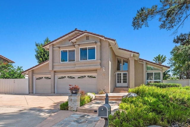 14040 Old Station Rd, San Diego, CA 92064 - traditional home featuring french doors, stucco siding, a tiled roof, and driveway