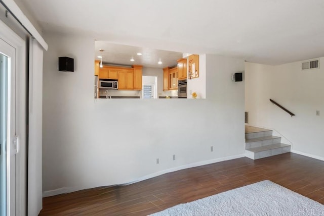 14040 Old Station Rd, San Diego, CA 92064 - unfurnished living room featuring dark wood-style flooring, recessed lighting, and stairs