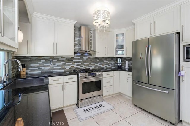 1725 Trinity Loop, Ontario, CA 91764 - kitchen with stainless steel appliances, wall chimney range hood, a sink, decorative backsplash, and white cabinets