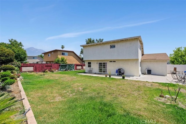 1725 Trinity Loop, Ontario, CA 91764 - back of house featuring a patio, central AC, a mountain view, and stucco siding