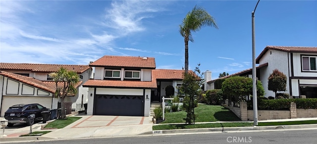 2937 Oakwood Ln, Torrance, CA 90505 - view of front of home featuring a tile roof, concrete driveway, stucco siding, and a garage