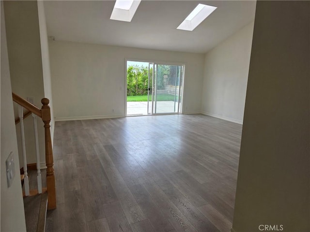 2937 Oakwood Ln, Torrance, CA 90505 - empty room with a skylight, lofted ceiling, wood finished floors, and baseboards