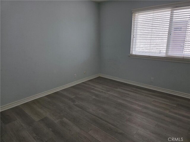 2937 Oakwood Ln, Torrance, CA 90505 - spare room featuring dark wood-type flooring, plenty of natural light, and baseboards