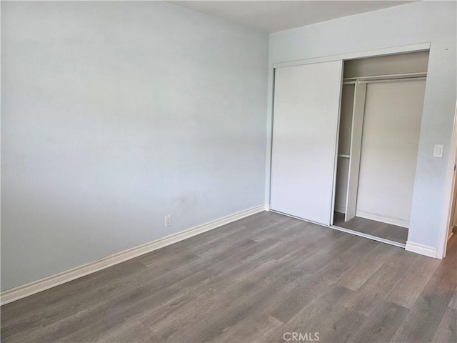 2937 Oakwood Ln, Torrance, CA 90505 - unfurnished bedroom with wood finished floors, baseboards, and a closet