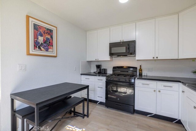 42692 Moonridge Rd, Big Bear Lake, CA 92315 - kitchen with black appliances, dark countertops, and tasteful backsplash