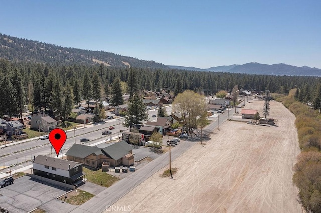 42692 Moonridge Rd, Big Bear Lake, CA 92315 - aerial perspective of suburban area featuring a forest and a mountain backdrop