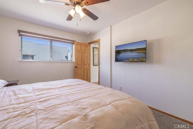 42692 Moonridge Rd, Big Bear Lake, CA 92315 - carpeted bedroom with baseboards and ceiling fan