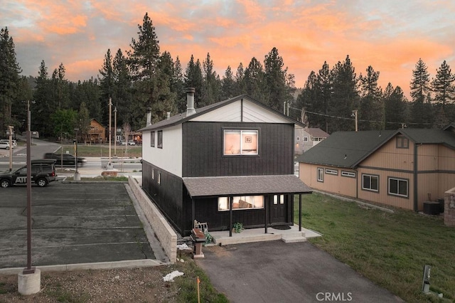 42692 Moonridge Rd, Big Bear Lake, CA 92315 - back of house featuring a lawn and central air condition unit