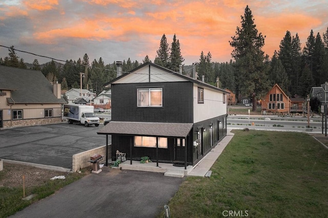 42692 Moonridge Rd, Big Bear Lake, CA 92315 - view of front of house featuring covered porch, roof with shingles, and driveway