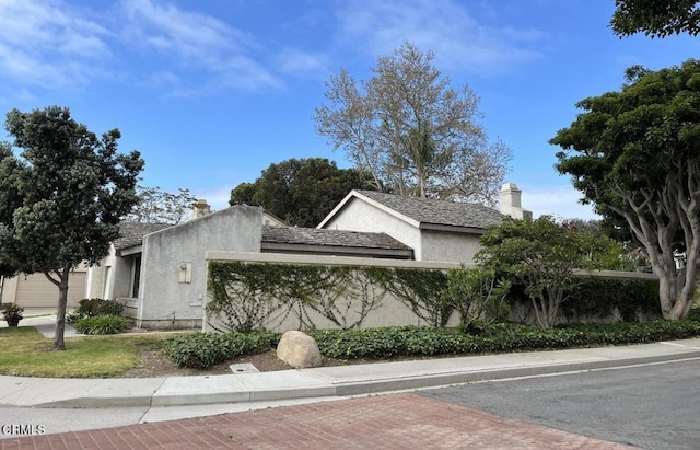 201 Village Rd, Port Hueneme, CA 93041 - view of front facade featuring a chimney and stucco siding