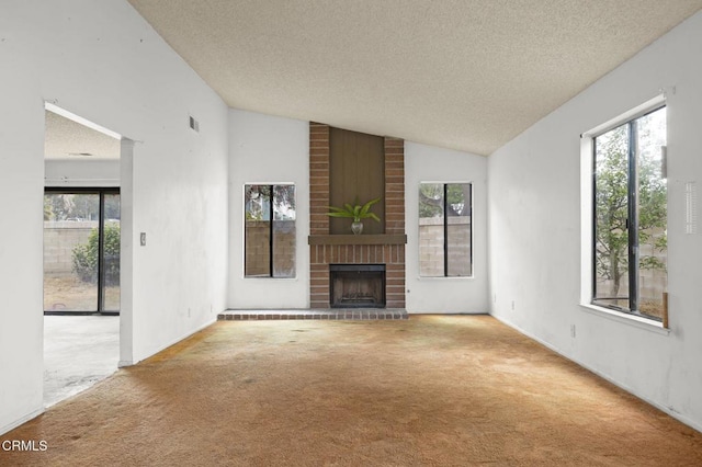 201 Village Rd, Port Hueneme, CA 93041 - unfurnished living room with a textured ceiling, carpet, lofted ceiling, and healthy amount of natural light