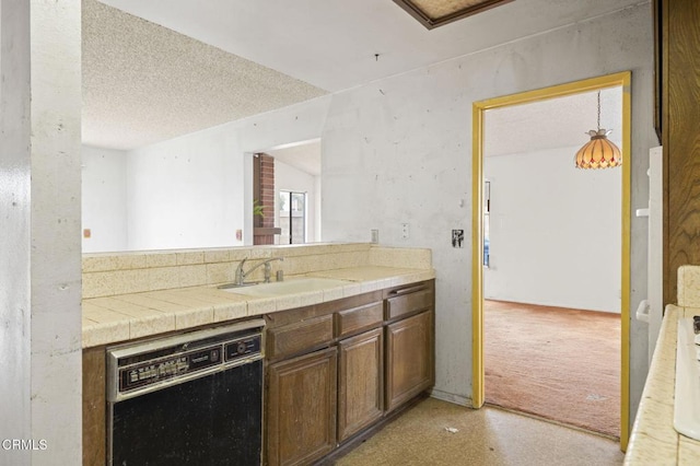 201 Village Rd, Port Hueneme, CA 93041 - kitchen featuring black dishwasher, a sink, tile countertops, and a textured ceiling
