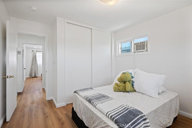 1630 247th Pl, Harbor City, CA 90710 - bedroom with light wood-style flooring, baseboards, a closet, and cooling unit