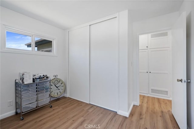 1630 247th Pl, Harbor City, CA 90710 - bedroom featuring light wood-style floors, a closet, and baseboards