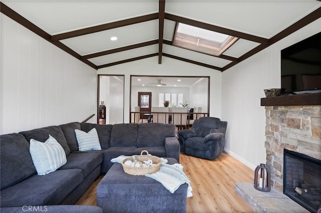 1630 247th Pl, Harbor City, CA 90710 - living area with light wood-style floors, a stone fireplace, a skylight, baseboards, and recessed lighting