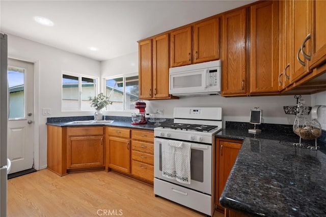 1630 247th Pl, Harbor City, CA 90710 - kitchen with white appliances, brown cabinets, light wood-style flooring, and recessed lighting