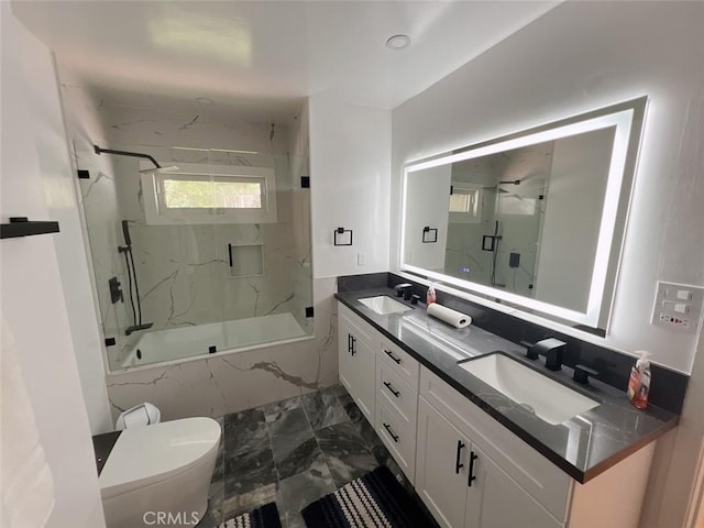 9466 Hidden Valley Pl, Beverly Hills, CA 90210 - bathroom with marble finish floors, double vanity, bath / shower combo with glass door, and toilet