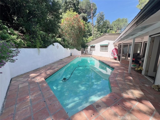 9466 Hidden Valley Pl, Beverly Hills, CA 90210 - view of swimming pool with a fenced backyard and a patio