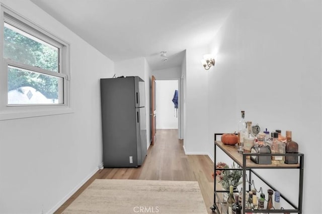 9466 Hidden Valley Pl, Beverly Hills, CA 90210 - hallway with light wood-style flooring and baseboards