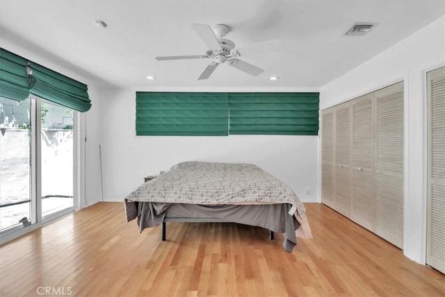 9466 Hidden Valley Pl, Beverly Hills, CA 90210 - bedroom featuring multiple closets, access to exterior, recessed lighting, light wood-style floors, and ceiling fan