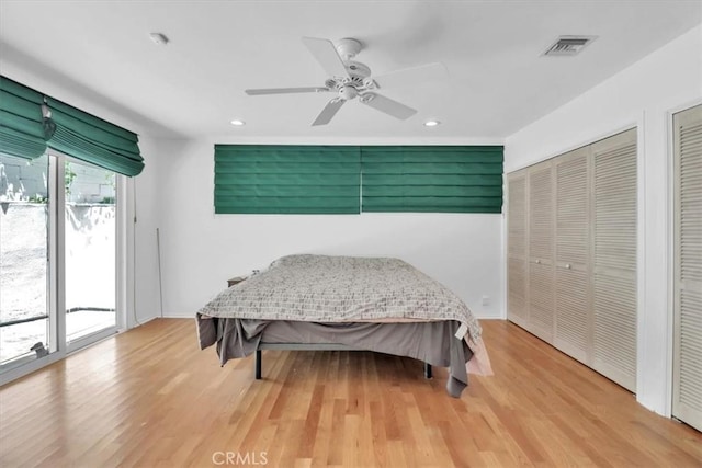 9466 Hidden Valley Pl, Beverly Hills, CA 90210 - bedroom with two closets, access to outside, light wood-style floors, recessed lighting, and a ceiling fan