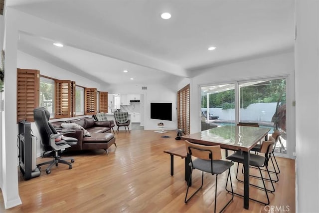 9466 Hidden Valley Pl, Beverly Hills, CA 90210 - dining space with healthy amount of natural light, lofted ceiling, light wood finished floors, and recessed lighting