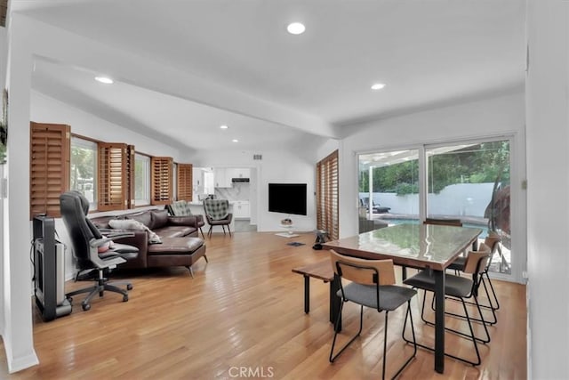 9466 Hidden Valley Pl, Beverly Hills, CA 90210 - dining room featuring plenty of natural light, lofted ceiling, light wood finished floors, and recessed lighting
