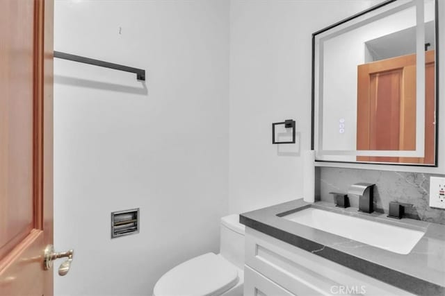 9466 Hidden Valley Pl, Beverly Hills, CA 90210 - bathroom with vanity and tasteful backsplash