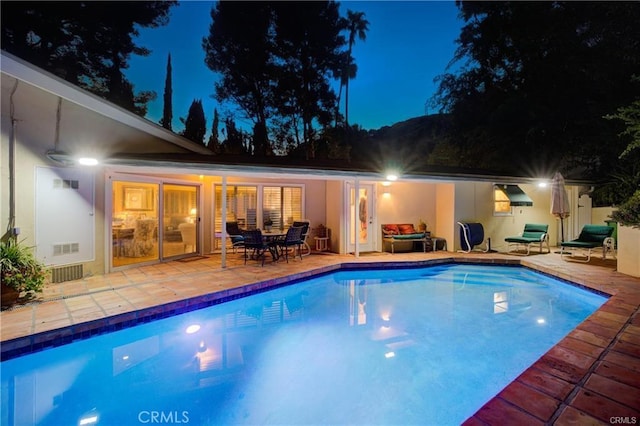 9466 Hidden Valley Pl, Beverly Hills, CA 90210 - pool at twilight with an outdoor pool and a patio