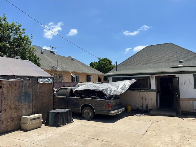 223 E 28th St, Los Angeles, CA 90011 - view of side of home with a shingled roof