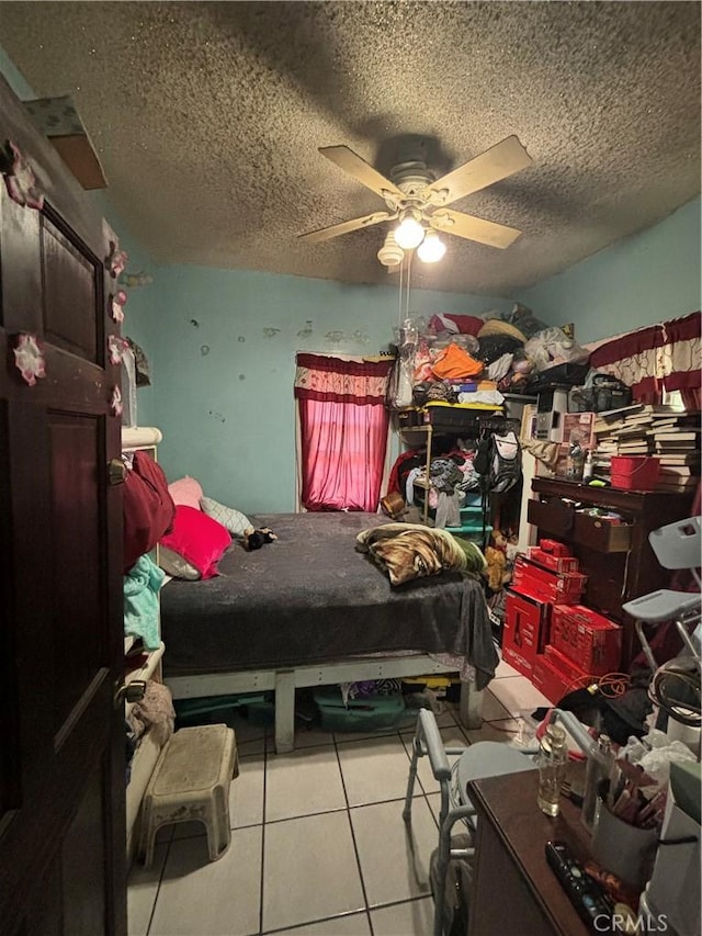 223 E 28th St, Los Angeles, CA 90011 - tiled bedroom featuring a textured ceiling and a ceiling fan