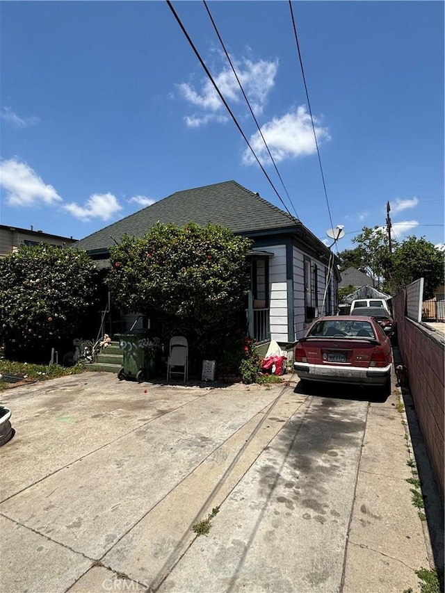 223 E 28th St, Los Angeles, CA 90011 - view of front of house featuring a shingled roof