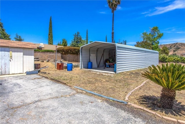 4256 Mockingbird Ln, Banning, CA 92220 - view of shed featuring a detached carport