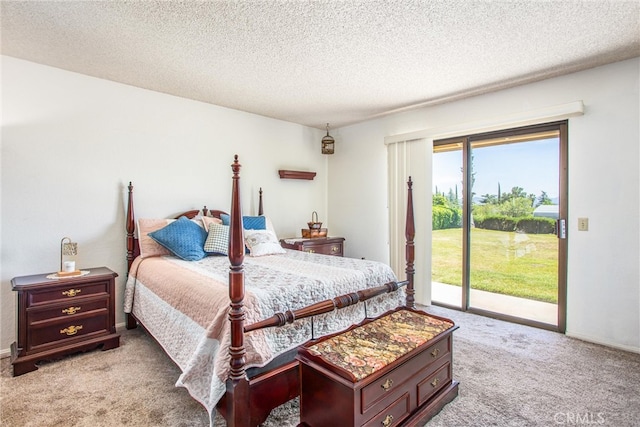 4256 Mockingbird Ln, Banning, CA 92220 - carpeted bedroom featuring access to exterior, a textured ceiling, and baseboards