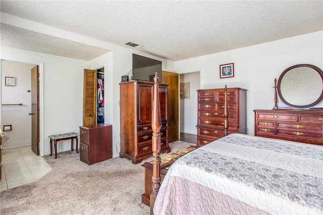 4256 Mockingbird Ln, Banning, CA 92220 - bedroom featuring a textured ceiling and light carpet