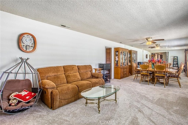 4256 Mockingbird Ln, Banning, CA 92220 - living area featuring carpet flooring, a textured ceiling, and ceiling fan
