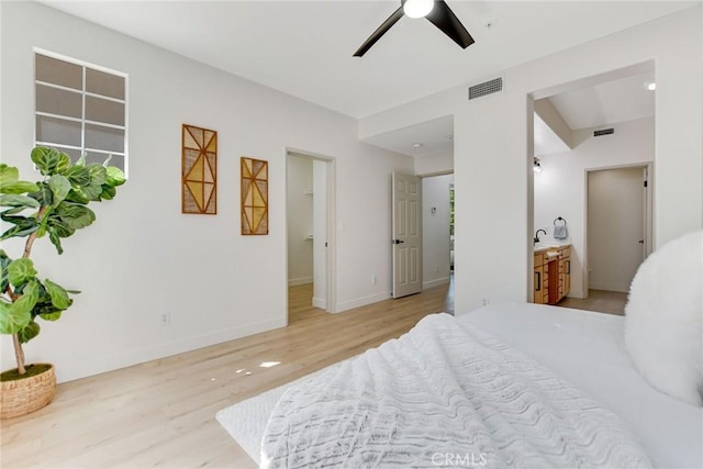 28210 Canterbury Ct, Valencia, CA 91354 - bedroom with wood finished floors, a sink, baseboards, and ceiling fan