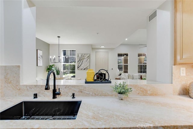 28210 Canterbury Ct, Valencia, CA 91354 - kitchen with a sink, backsplash, recessed lighting, light stone counters, and open floor plan